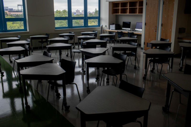 Image of a darkened, empty classroom.