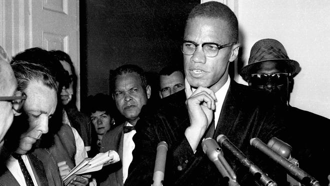 FILE--Slain civil rights leader Malcolm X speaks to reporters in Washington, D.C., in this May 16, 1963 file photo. An early morning fire left Betty Shabazz, 63, the widow of Malcolm X, clinging to life Sunday June 1, 1997, with third-degree burns over 80 percent of her body. Authorities said a young relative was arrested in connection with the fire. (AP Photo/file) ORG XMIT: NYR25