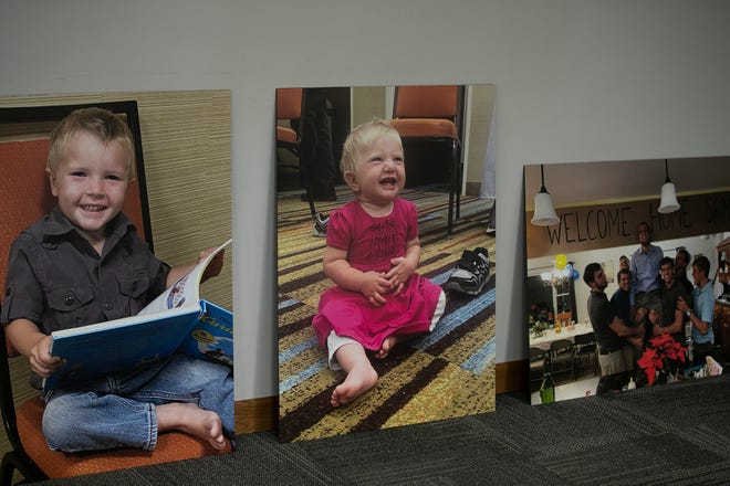 From left, a photo of the 3 year old hostage, a photo of the 10 month old hostage, and a photo of one of the hostages being welcomed home by his brothers, during a press conference at Christian Aid Ministries, in Berlin, Ohio, Monday, December 20, 2021. All 17 staff members of Christian Aid Ministries who were held hostage in Haiti by the 400 Mawozo gang, have returned home.